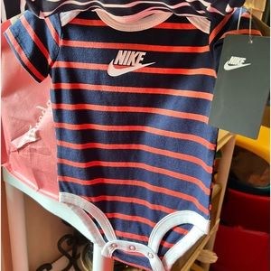 Brand New with Tags Nike Onesie- 3pack. Size 9months